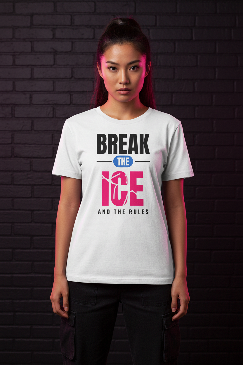 Woman with a high ponytail in the white Break the Ice graphic tee, brick wall