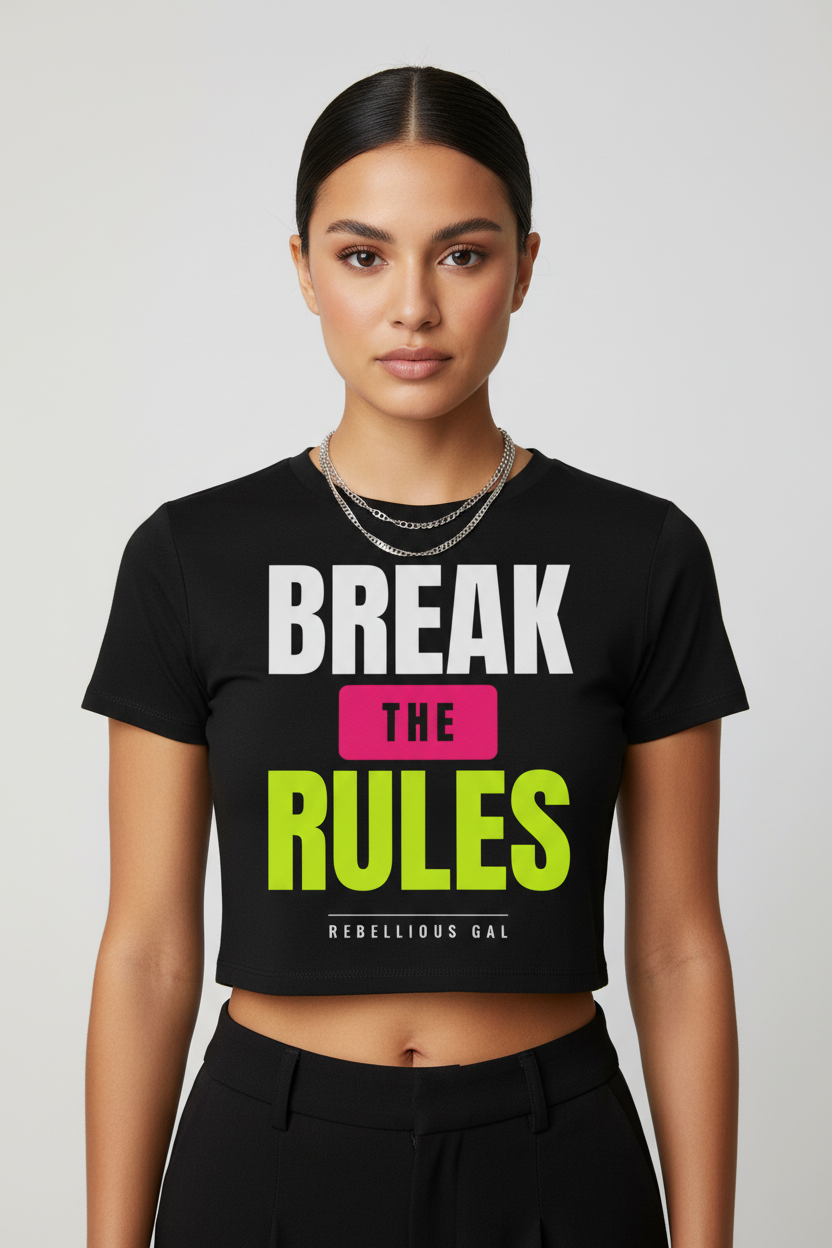 Woman with a sleek bun in black Break the Rules fitted crop tee and silver chains