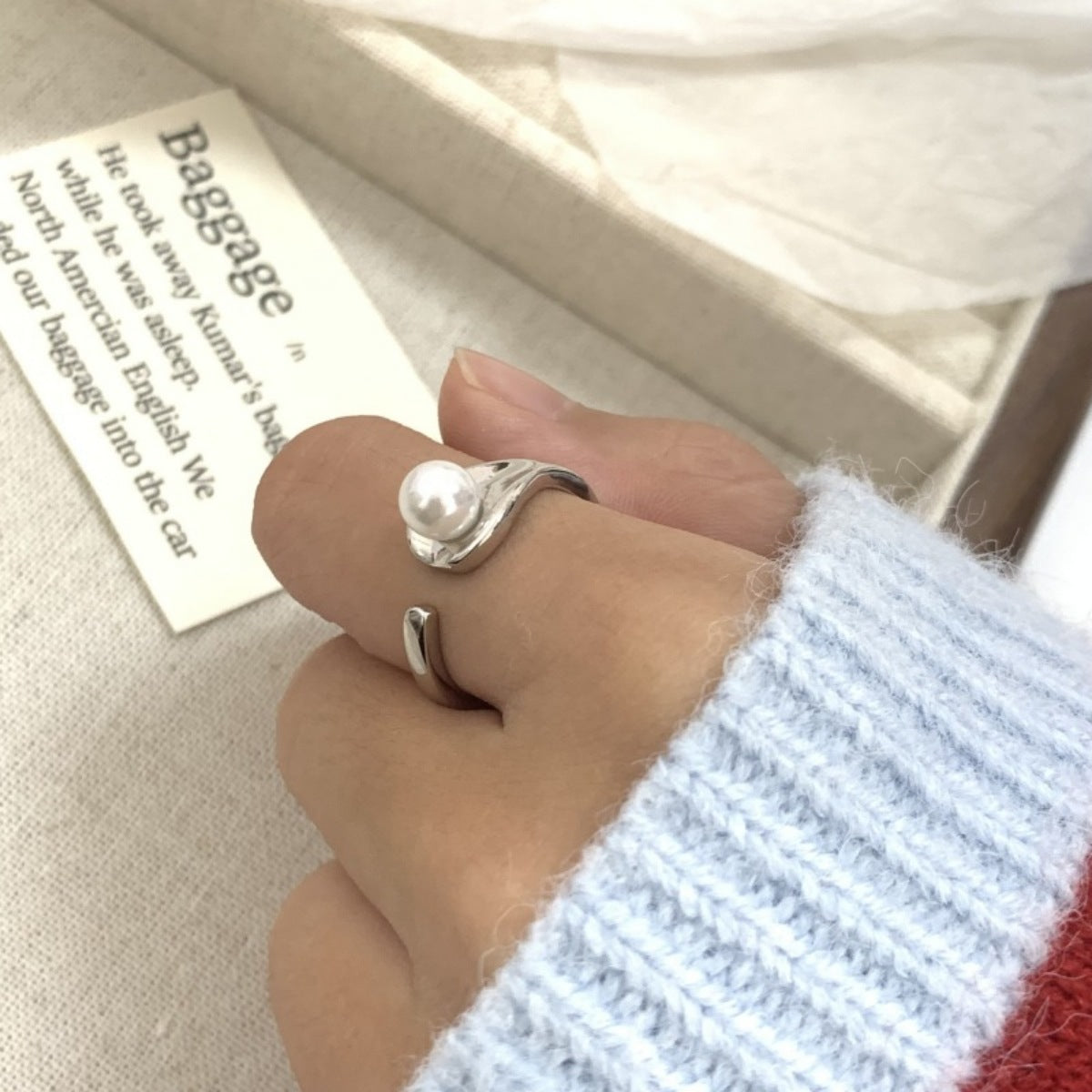 Detail of freshwater pearl luster against sterling silver metal