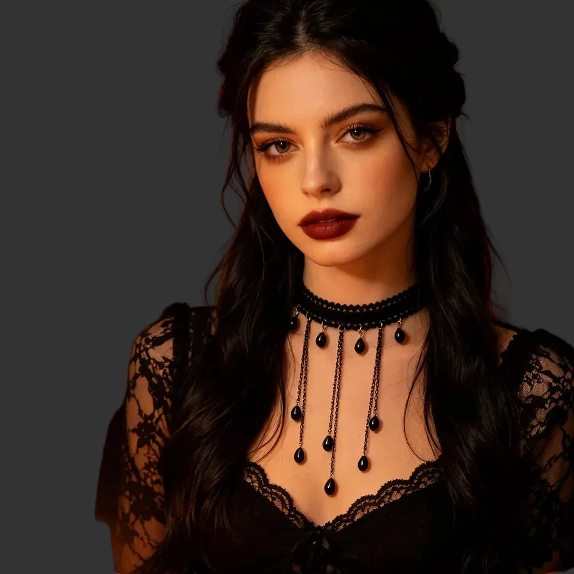 Black lace choker necklace with teardrop bead charms worn with a black lace top