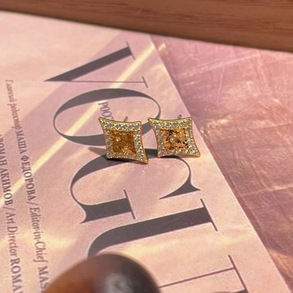 Detail shot of polished 18K gold plating and sharp geometric lines