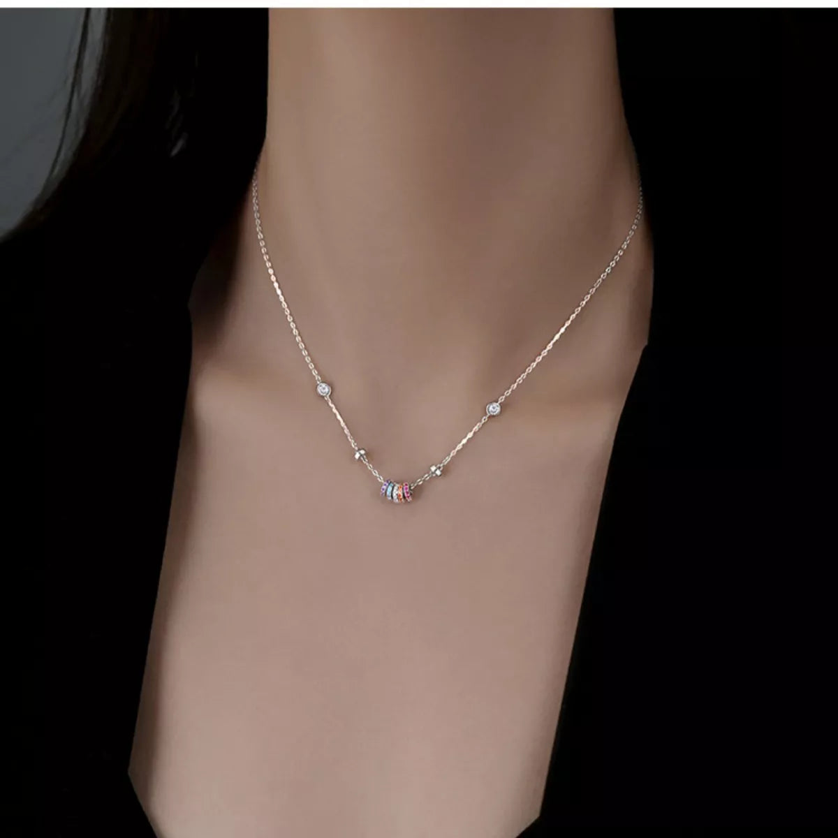Model wearing Rebellious Gal rose gold zircon pendant with rebellious layered look