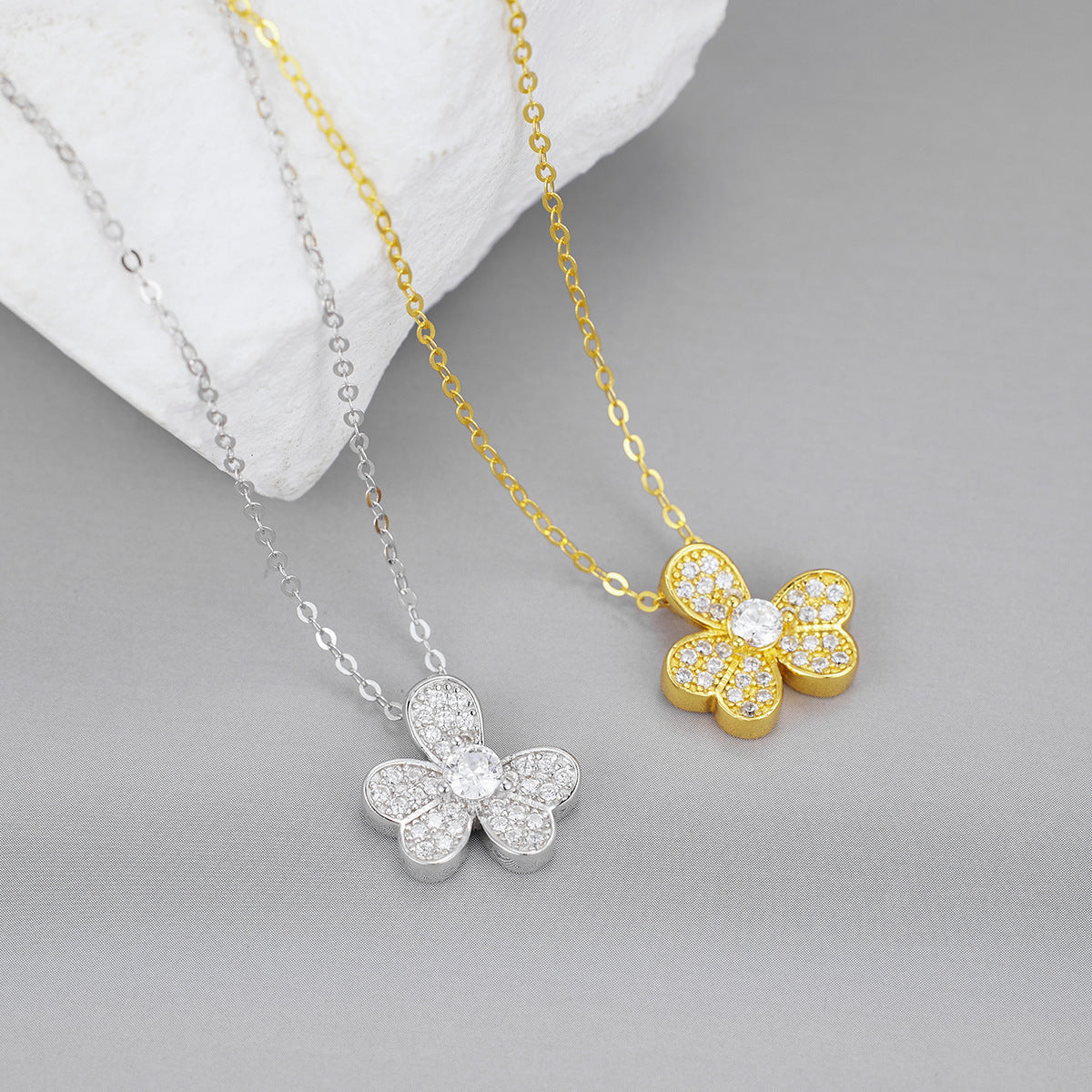 Four leaf clover pendant necklace in 18K gold-plated 925 sterling silver on model neck