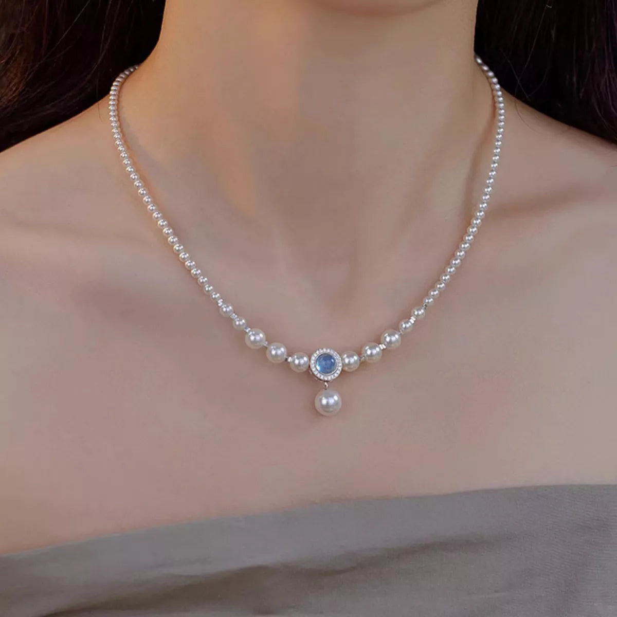 Side profile of pearl necklace showing 15.7" chain and 2" extension