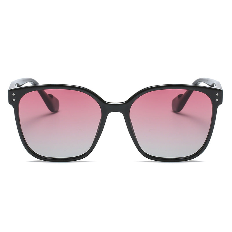 Fashion-forward oversized gradient sunglasses styled with rebellious jewelry