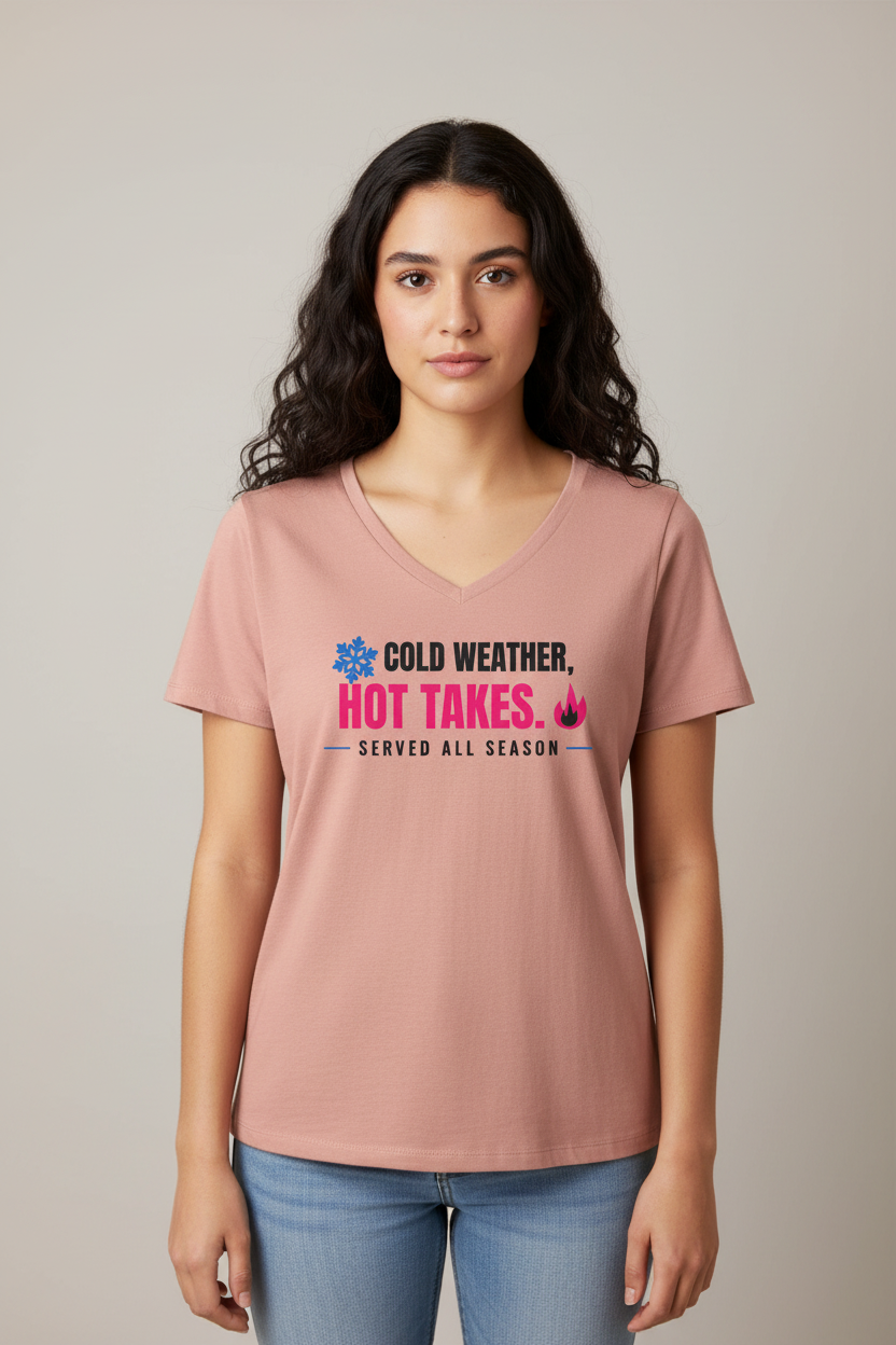 Woman with dark wavy hair in the dusty rose Cold Weather Hot Takes V-neck, pale backdrop