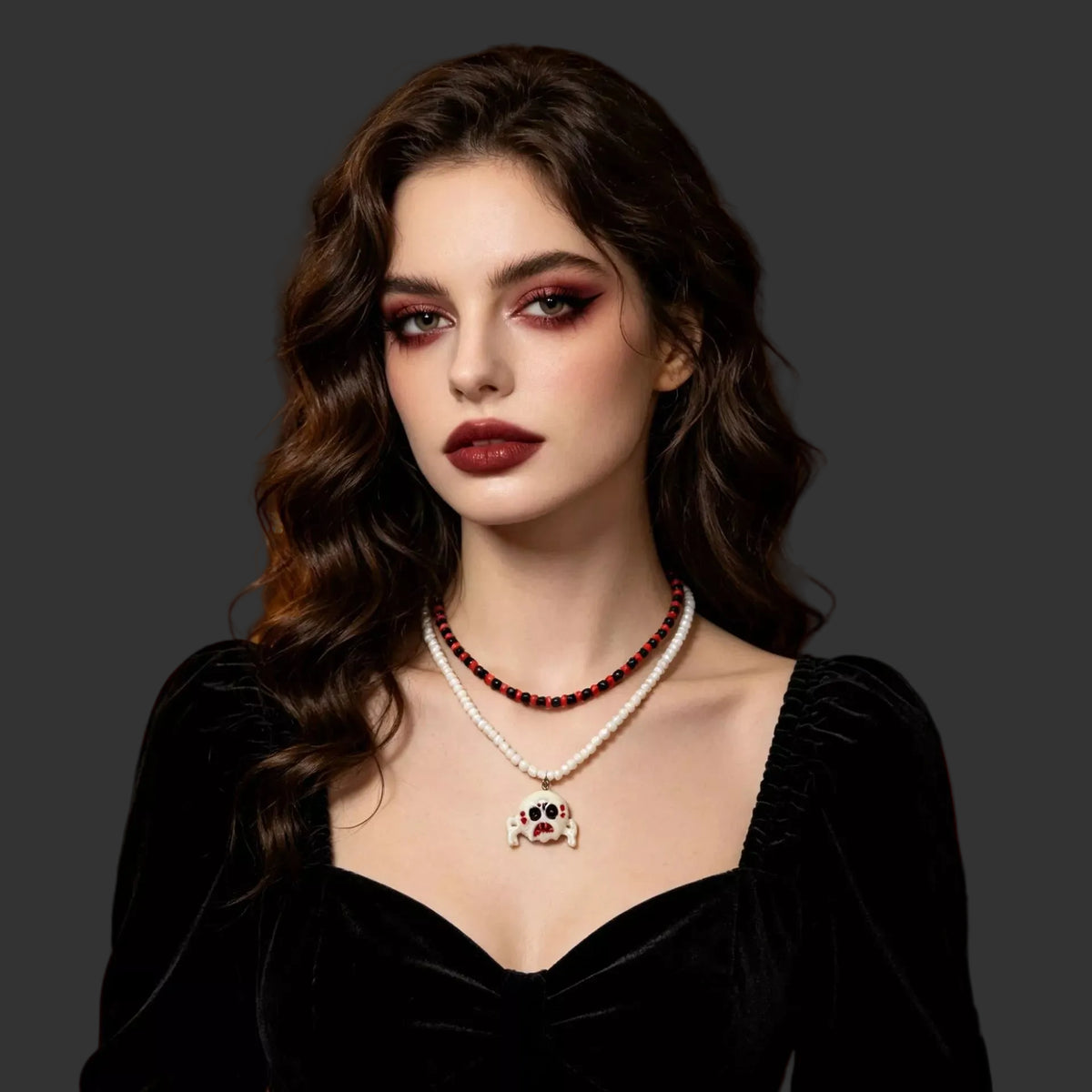 Seed bead necklace with a white skull charm worn with a black velvet dress
