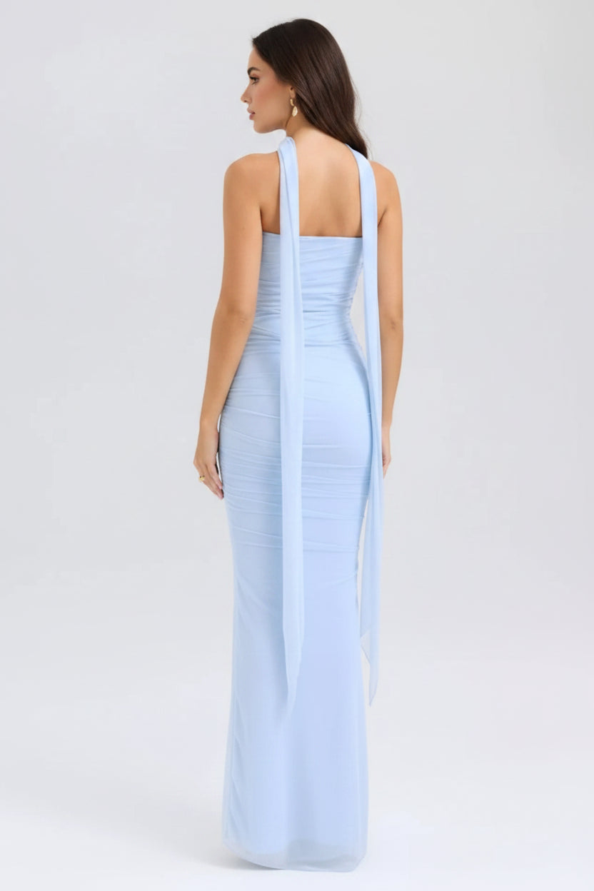Light blue evening gown with a slit on a white background