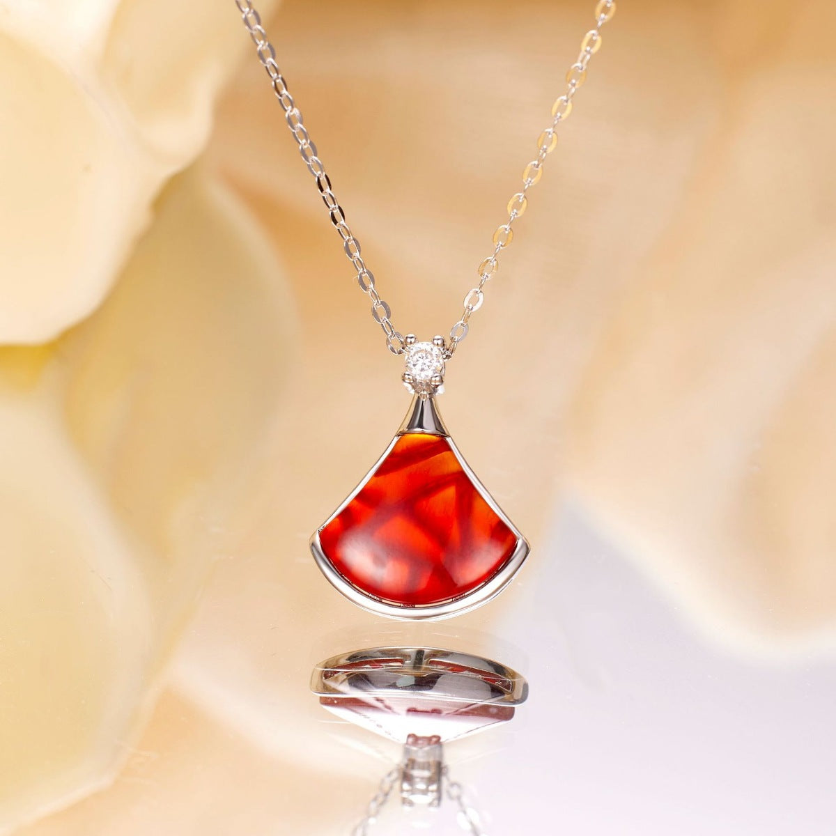 Model wearing Rebellious Gal red agate fan pendant with rebellious layered look
