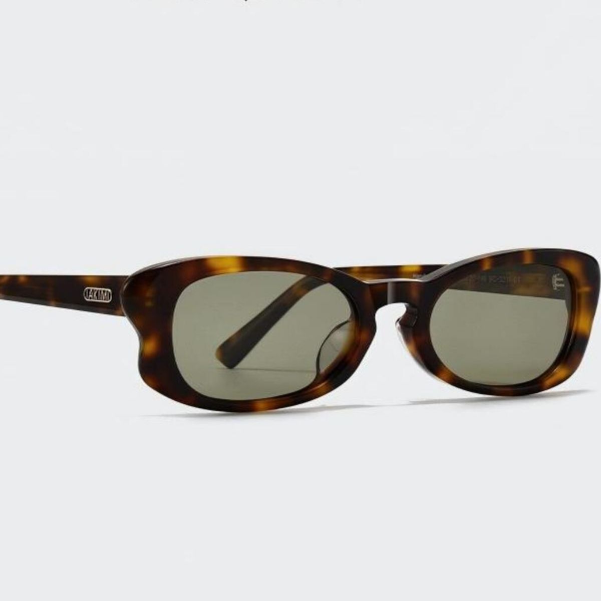 Close-up of rich marbled tortoiseshell acetate frame with UV400 protection detail
