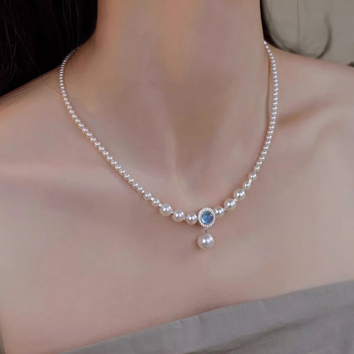 Lifestyle image: Rebellious Gal pearl necklace styled with edgy outfit