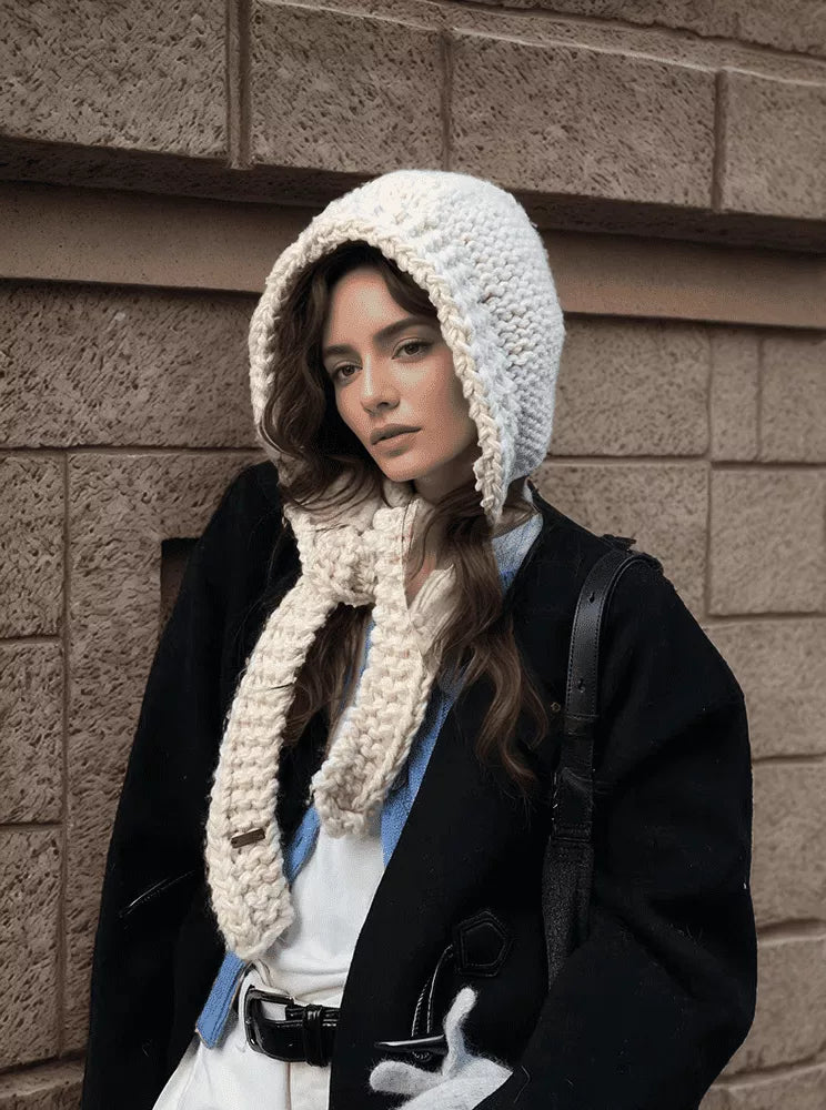 Knitted hooded scarf hat in cozy polyester knit on rebellious woman winter street style 2026