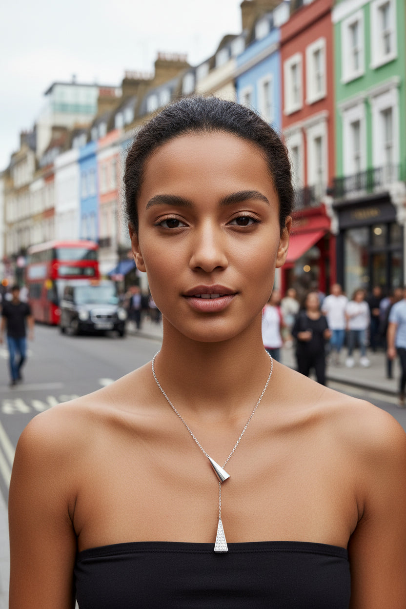 Silver necklace with pendant on a mixed race model in Soho London