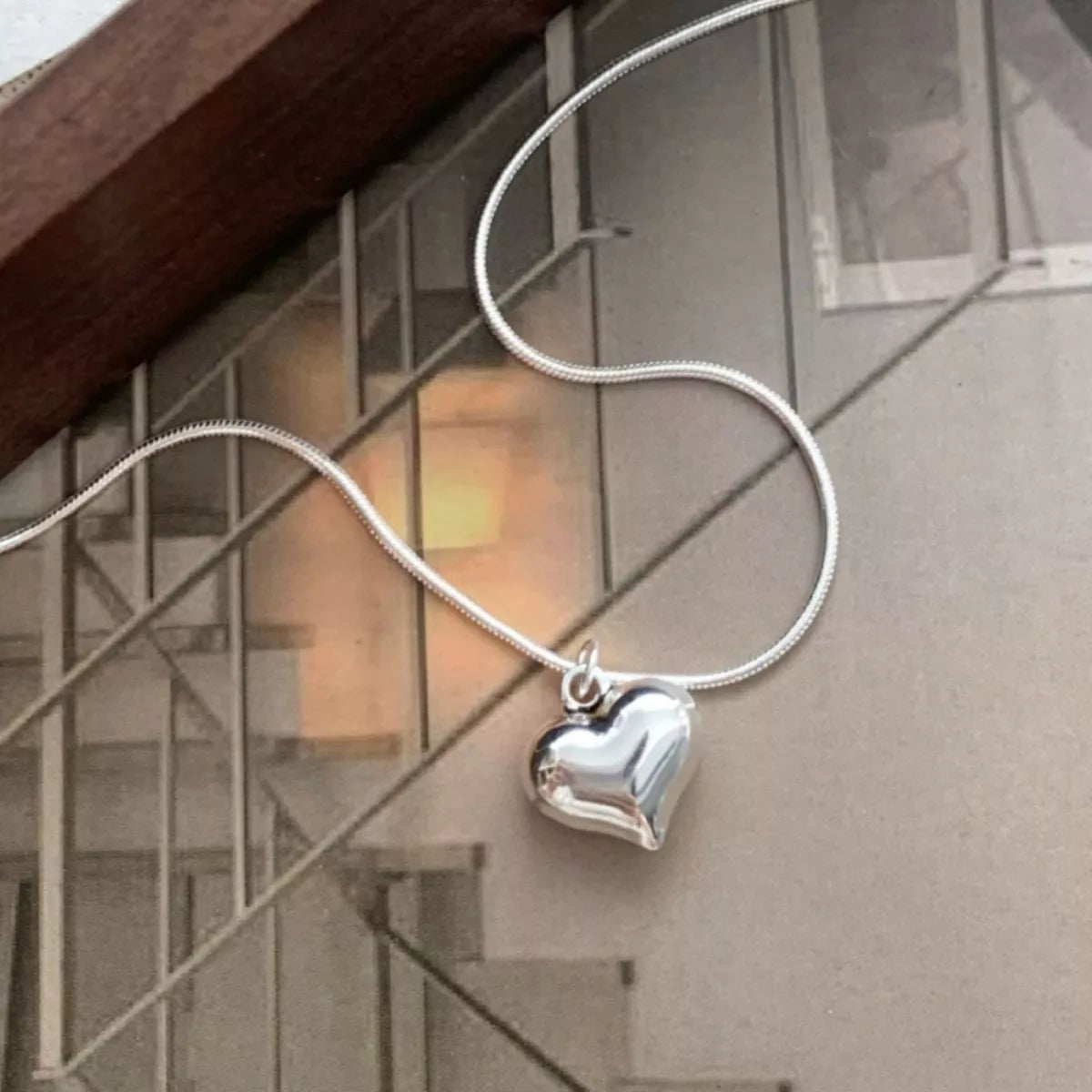 Close-up of 925 sterling silver heart necklace platinum plated
