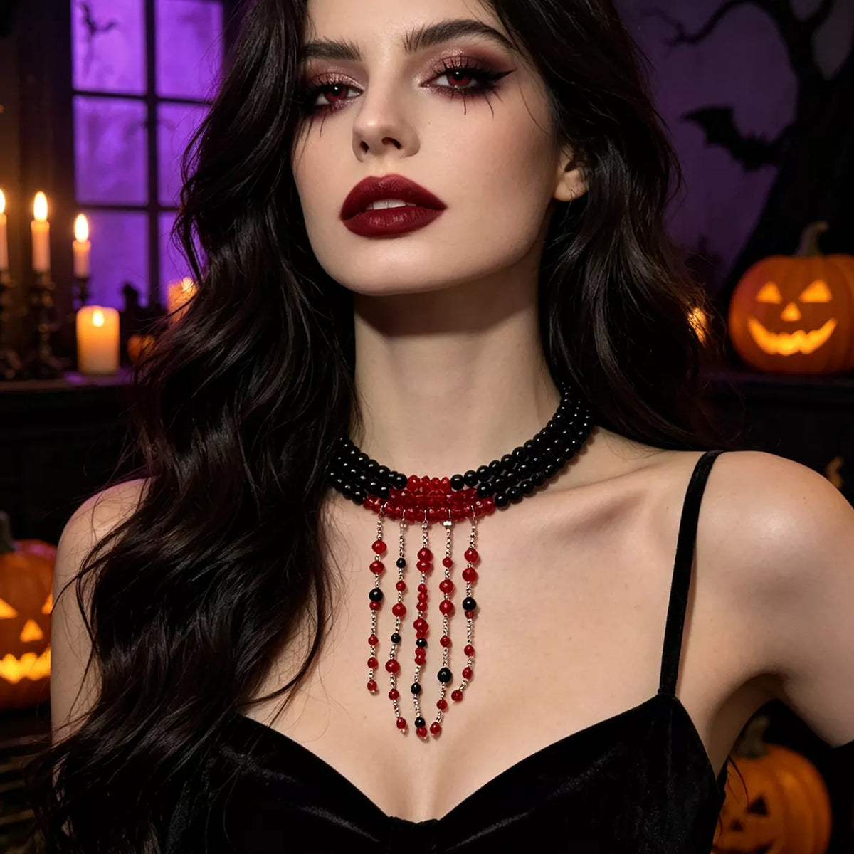 Black bead choker with red beaded fringe worn with a black velvet camisole