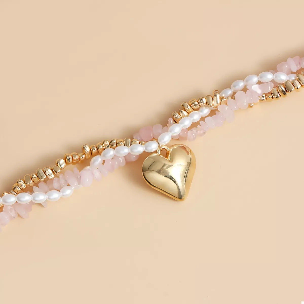 Heart pendant necklace shown against white background