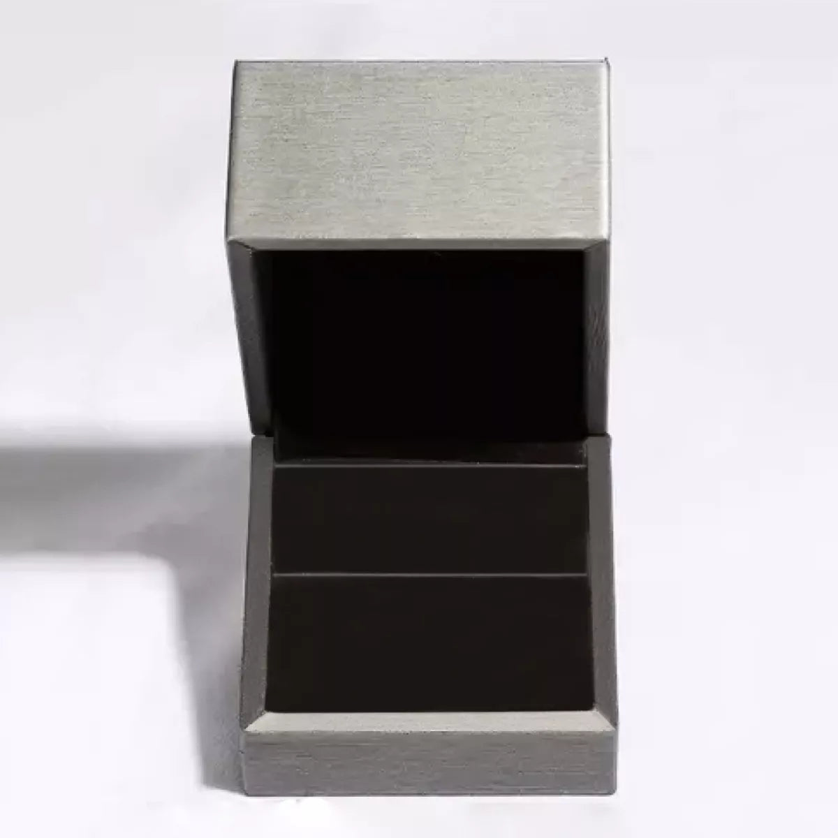 Product shot of crown circle stud earrings arranged neatly with matching box