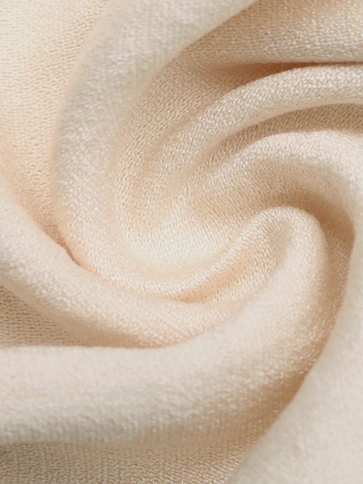 Close-up of beige fabric with a soft texture