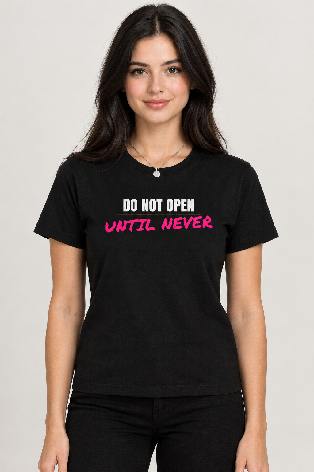 Woman in the black Do Not Open Until Never tee with a silver pendant necklace