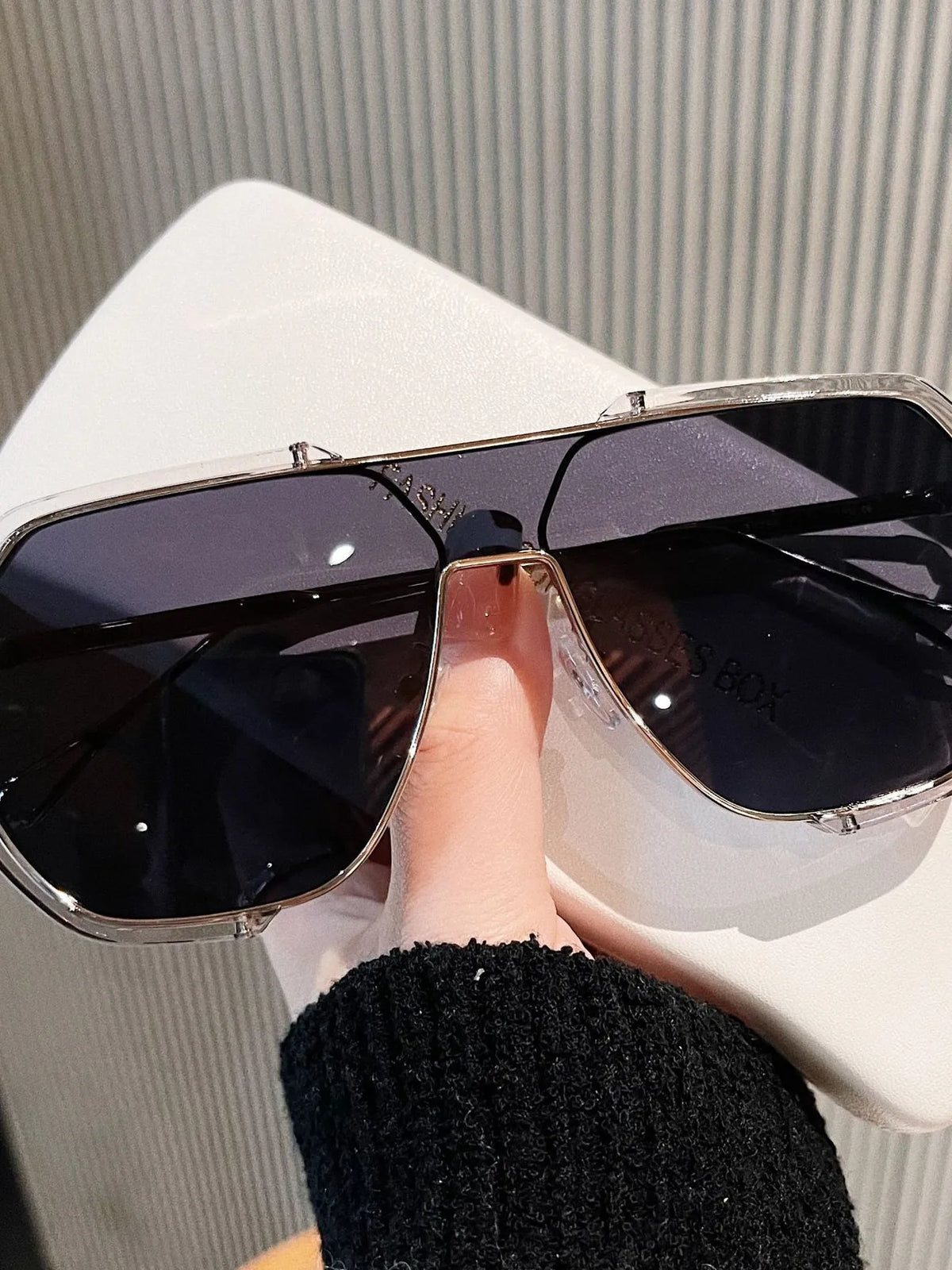 Bold women's oversized shades alloy metal temples acrylic lenses close-up