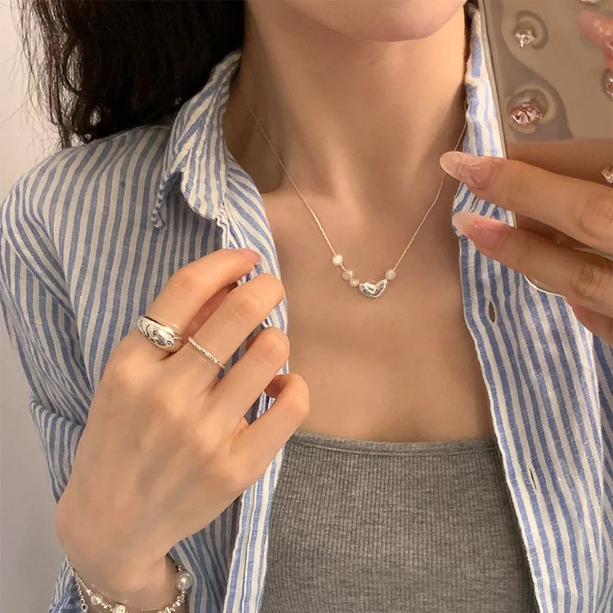Freshwater pearl necklace with heart detail on silver chain