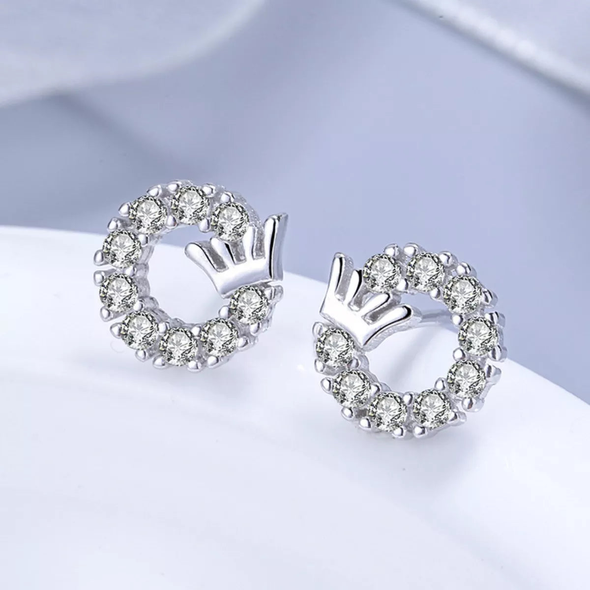 Side profile of 0.4" crown circle stud earrings showing delicate design