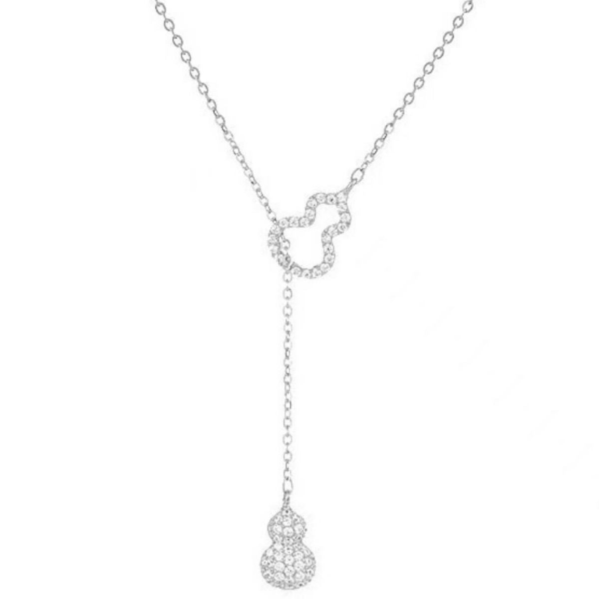 Flat lay of 18K gold-plated zircon pendant necklace with matching luxury gift box
