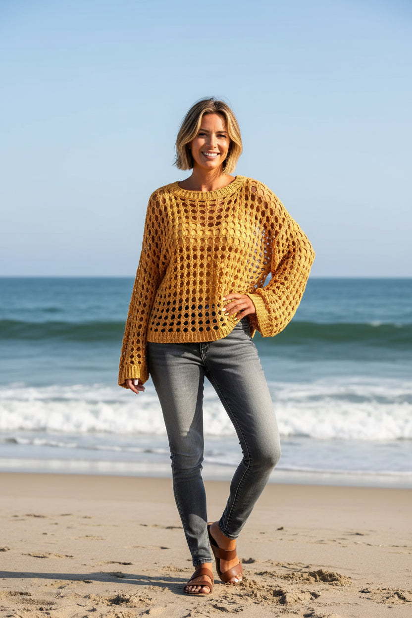 Yellow crochet cover-up with a blurred background