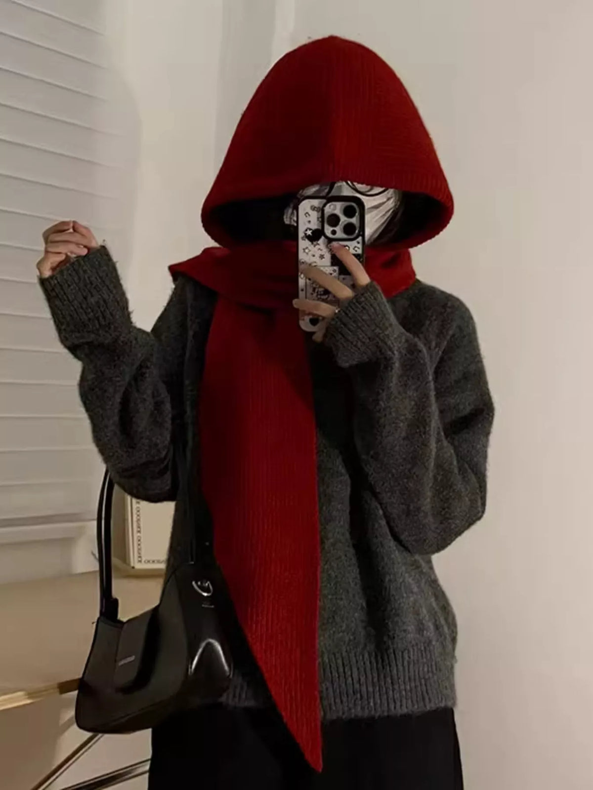 Close-up cozy polyester knitted beanie hat with long attached scarf tails