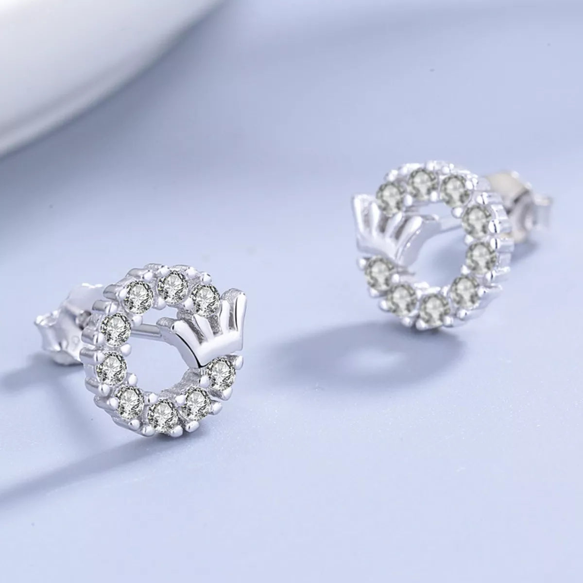 Detail of crown motif and secure stud backing on sterling silver base