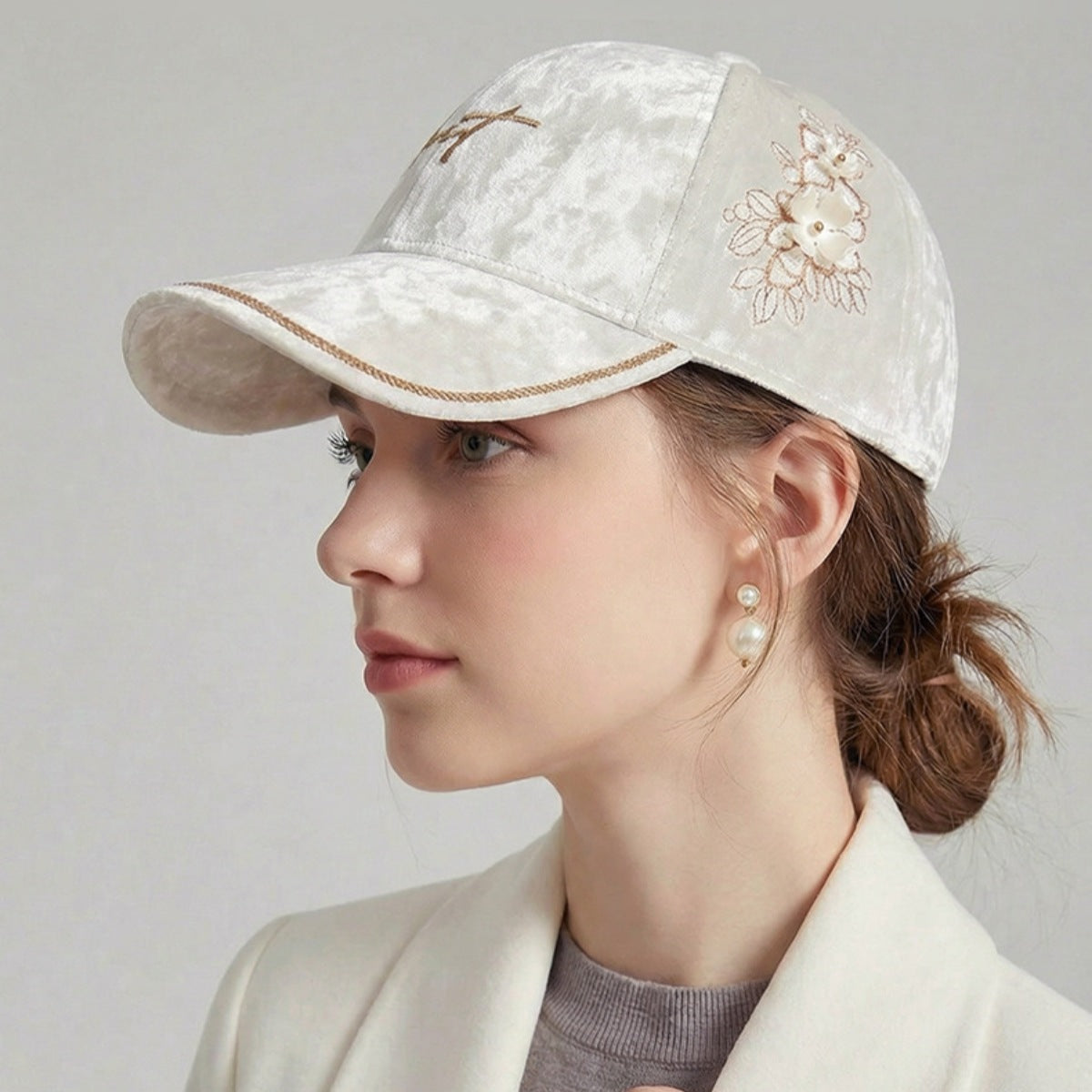 Model wearing tilted velvet floral baseball cap with rebellious street style outfit