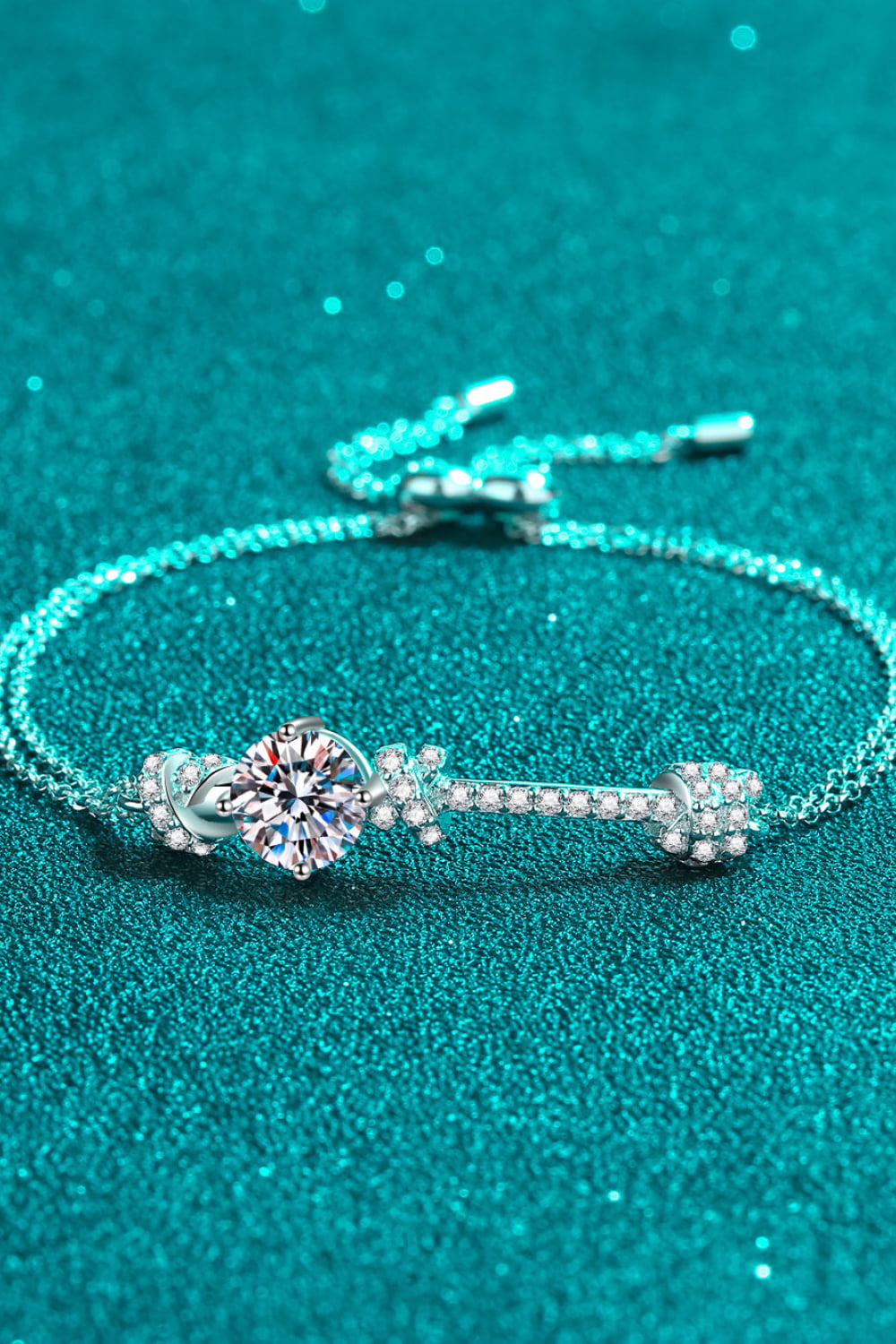 Model wearing Rebellious Gal 2 carat moissanite bracelet with rebellious layered jewelry
