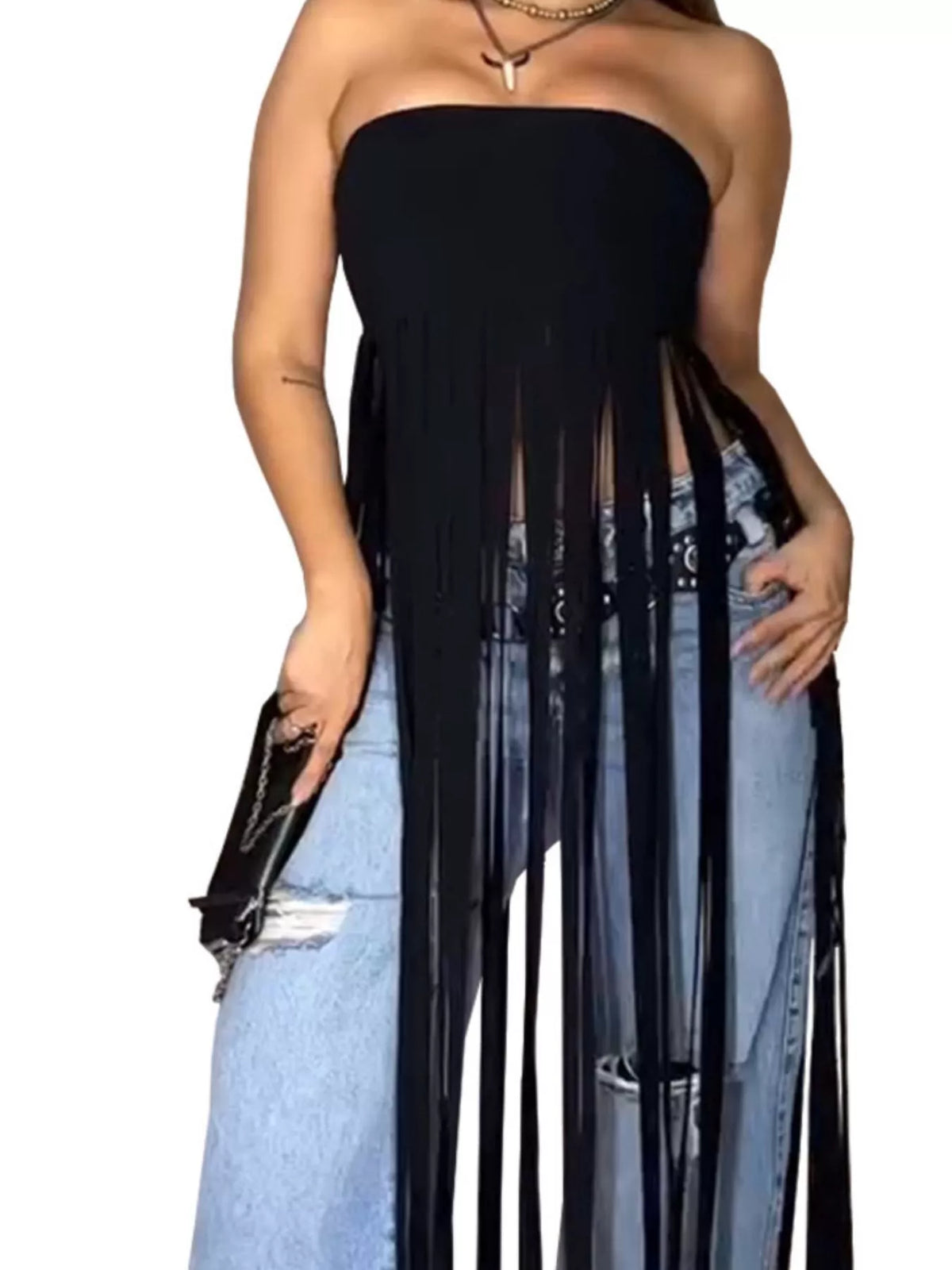 Black strapless dress with sheer panels over denim jeans on a white background