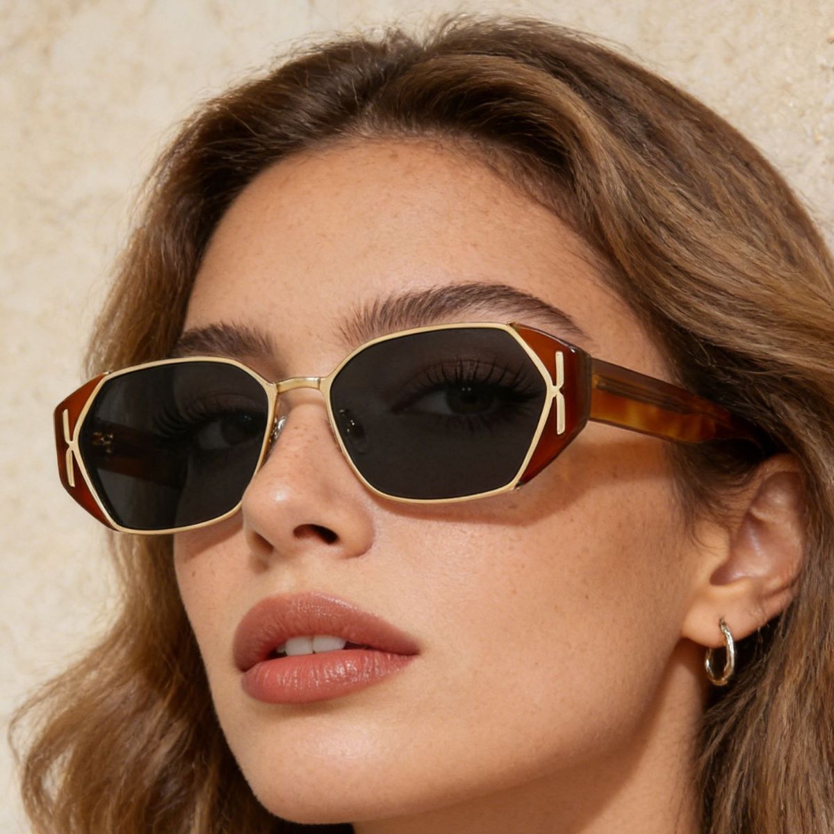 Model wearing Rebellious Gal geometric sunglasses with edgy streetwear look
