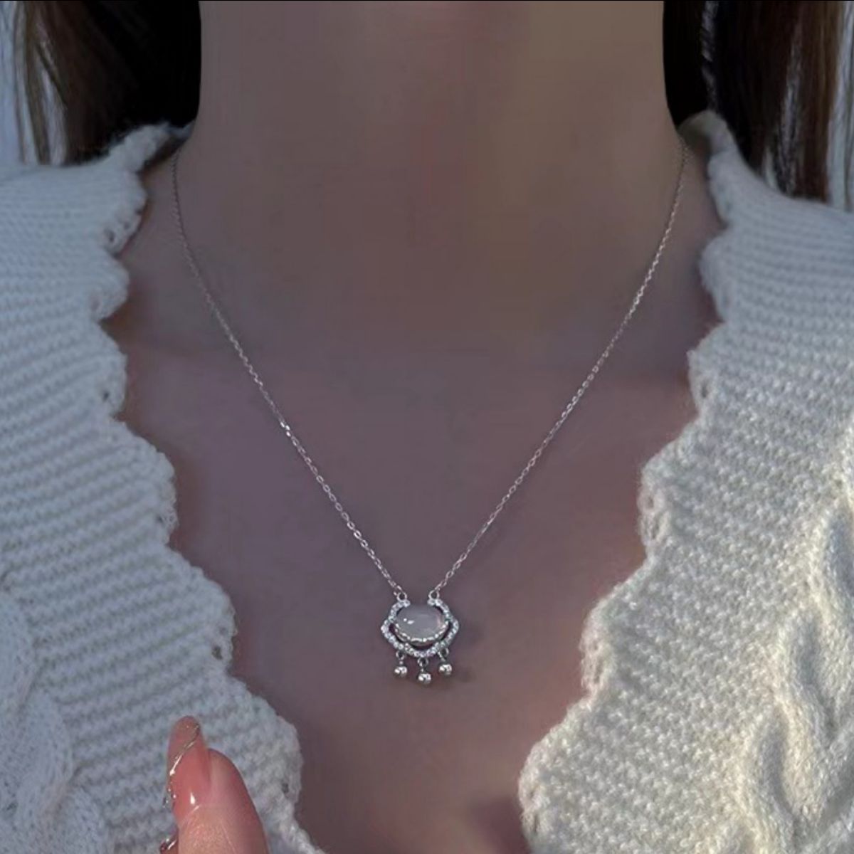 Model wearing Rebellious Gal auspicious lock pendant with rebellious layered look