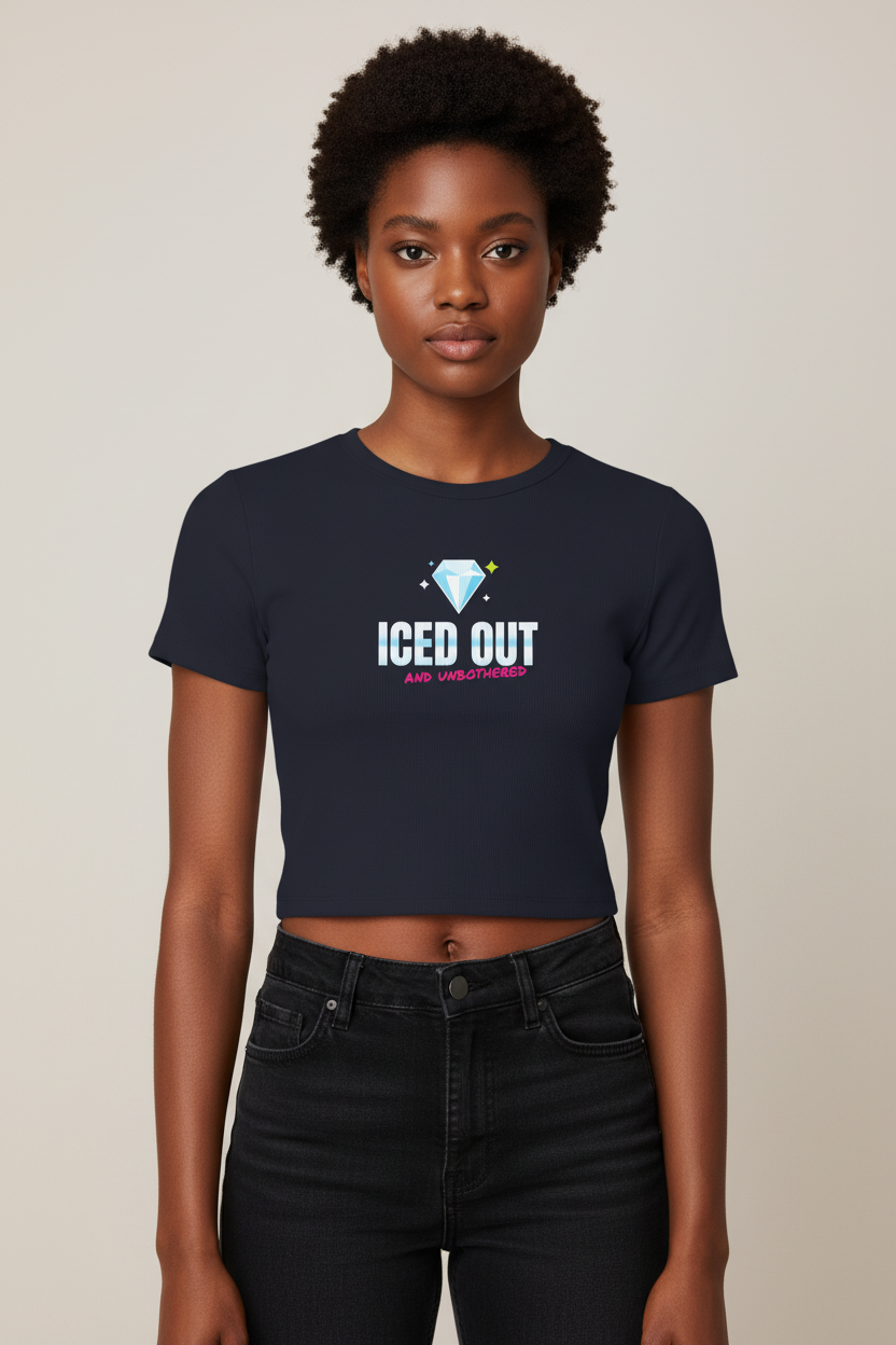 Woman with a short afro in the navy Iced Out rib crop tee, pale backdrop