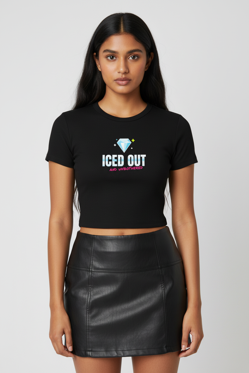Woman with long dark hair in the black Iced Out rib crop tee, studio backdrop