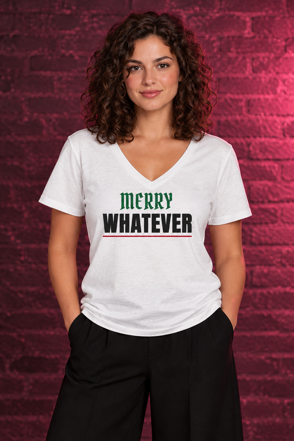 Woman with curly hair in the white Merry Whatever V-neck tee, brick wall