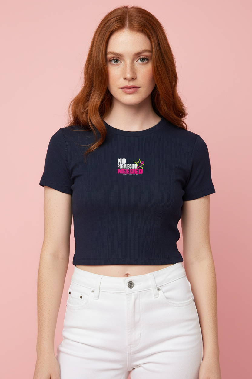 Freckled redhead in the navy No Permission Needed baby rib crop tee and white jeans