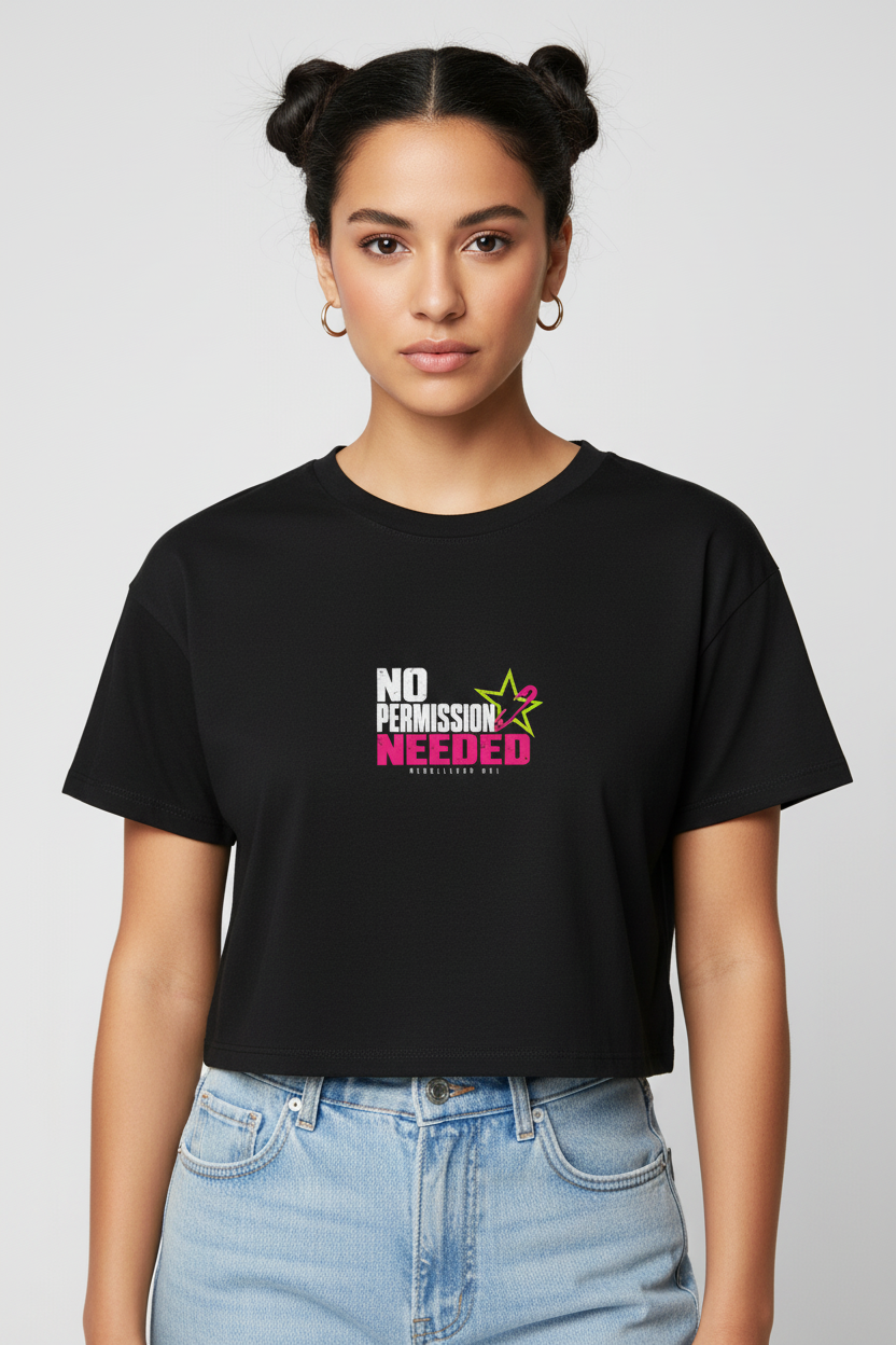 Woman with space buns wearing the black No Permission Needed boxy crop top with light jeans