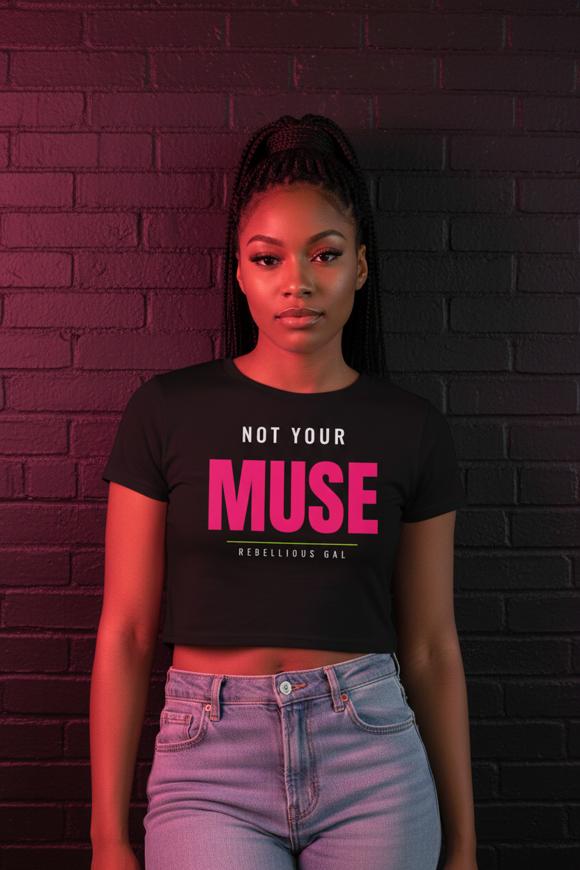 Woman with a braided ponytail in the black Not Your Muse fitted crop tee, brick wall