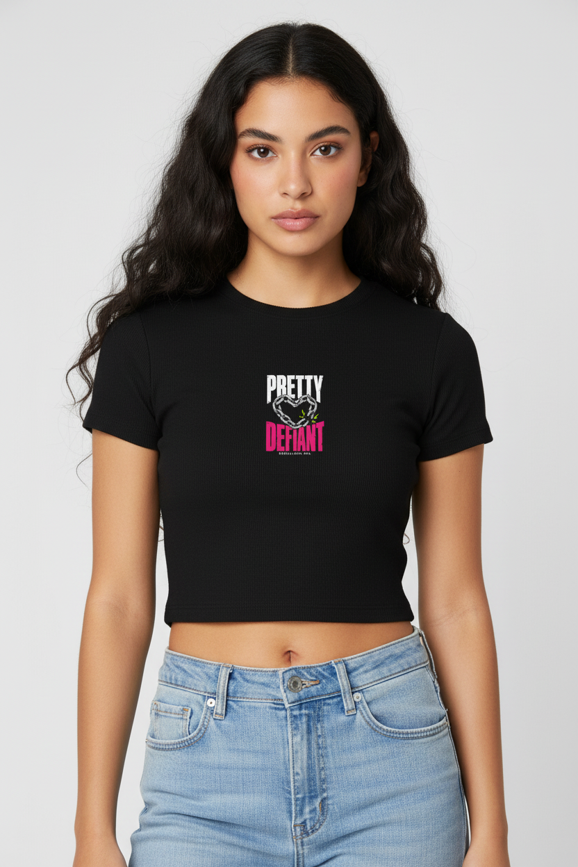 Woman with long dark waves in the black Pretty Defiant baby rib crop tee and jeans