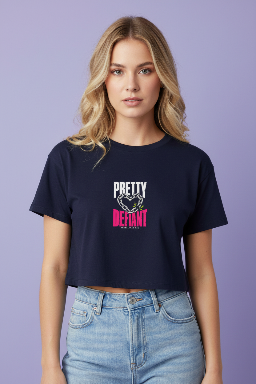 Woman with long blonde waves wearing the navy Pretty Defiant boxy crop top with light jeans