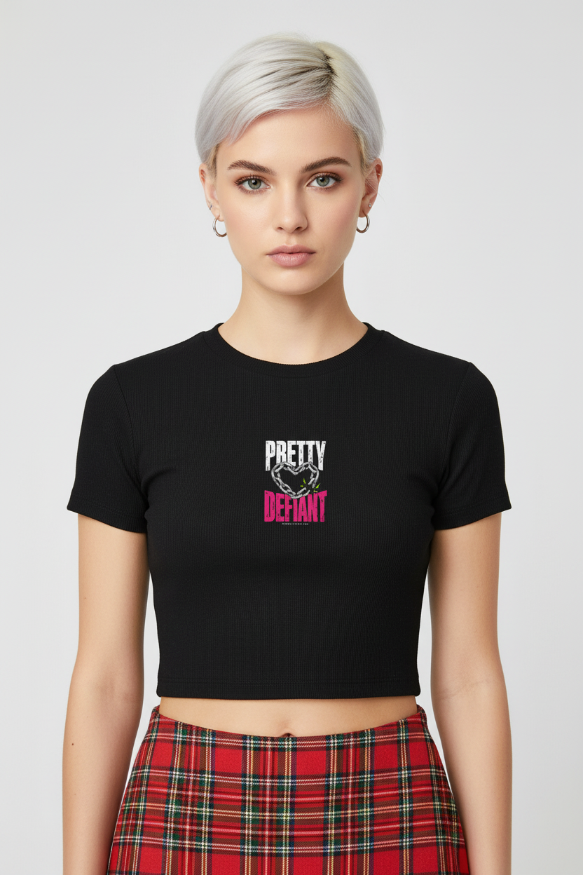 Platinum-haired woman in the black Pretty Defiant Faded baby rib crop tee and red plaid skirt
