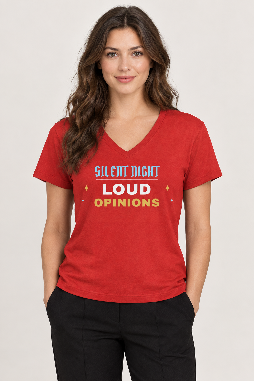Woman with wavy brown hair in the red Silent Night Loud Opinions V-neck tee, pale backdrop