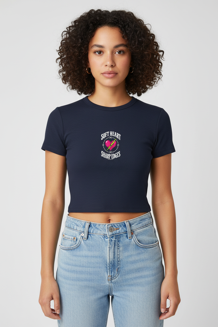 Woman with a curly bob in the navy Soft Heart Sharp Edges baby rib crop tee
