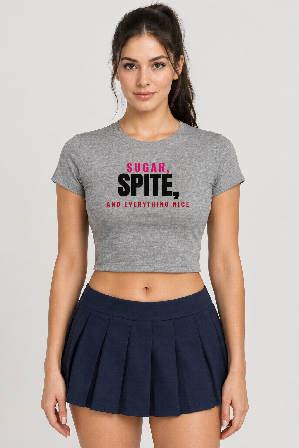 Woman with a dark ponytail in the heather grey Sugar Spite Everything Nice crop tee