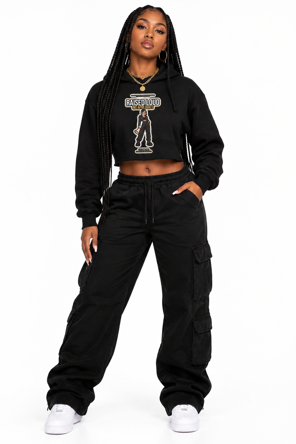 Woman with long braids in the black Loud Girl crop hoodie and layered gold chains
