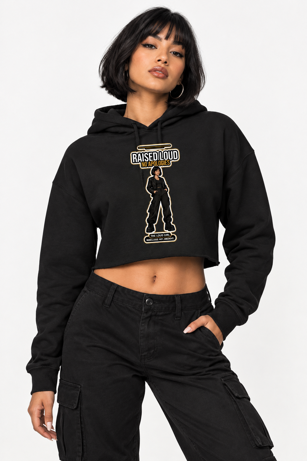 Woman with a dark bob in the black lightweight crop hoodie with the Raised Loud No Apologies print