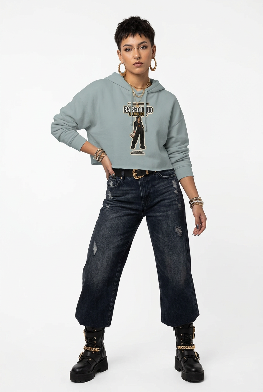 Sage green cropped hoodie, cuffed dark jeans and chunky platform boots on a pale backdrop